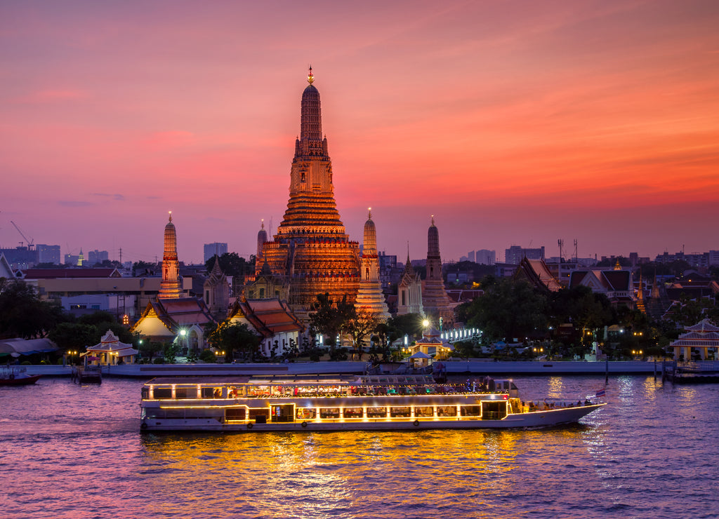 Wat Arun and cruise ship in sunset time, Bangkok city, Thailand