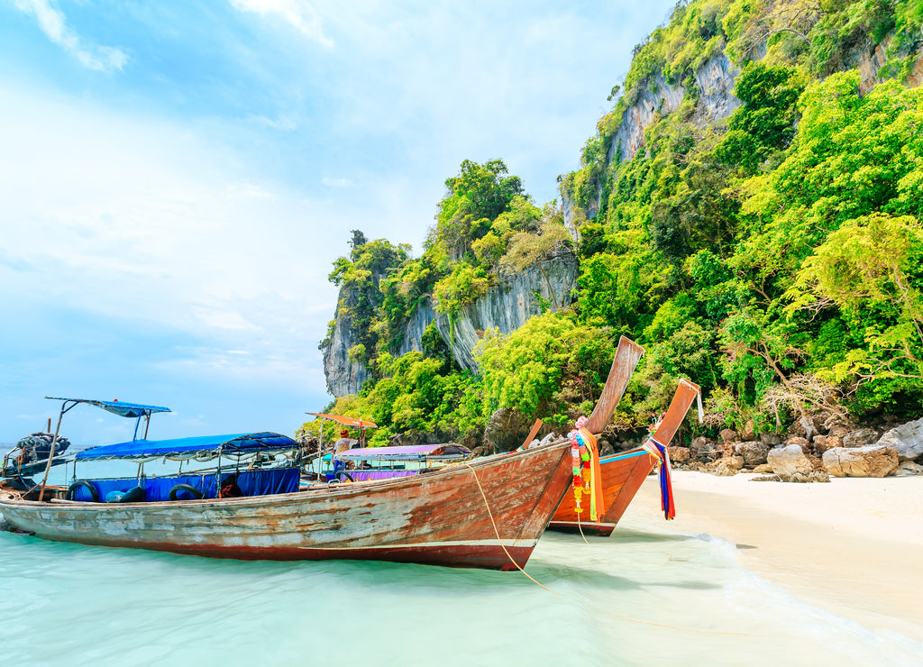 Longtale boat on the white beach at Phuket, Thailand