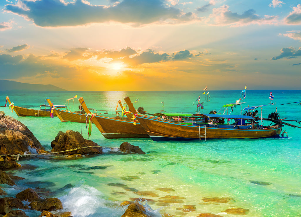 Vibrant sunset over Bamboo island of Thailand in summer holiday on tropical beach of Phi Phi region