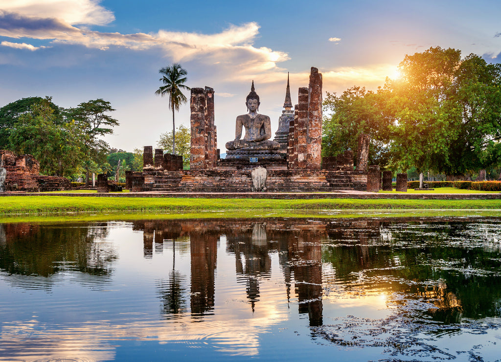 Buddha statue and Wat Mahathat Temple in the precinct of Sukhothai Historical Park, Wat Mahathat Temple is UNESCO World Heritage Site, Thailand