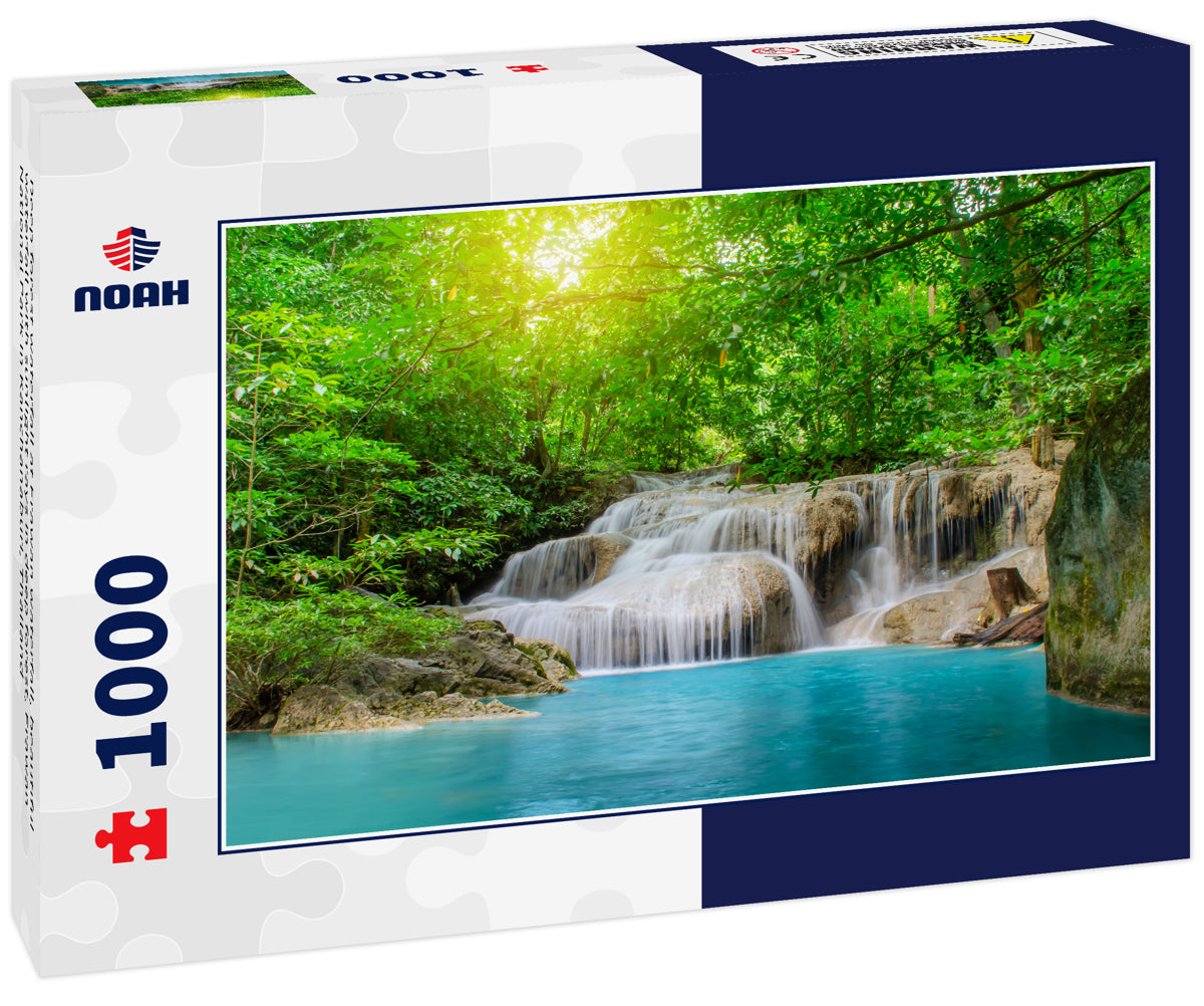 Deep forest waterfall at Erawan waterfall, beautiful waterfall with sunlight rays in deep forest, Erawan National Park in Kanchanaburi, Thailand