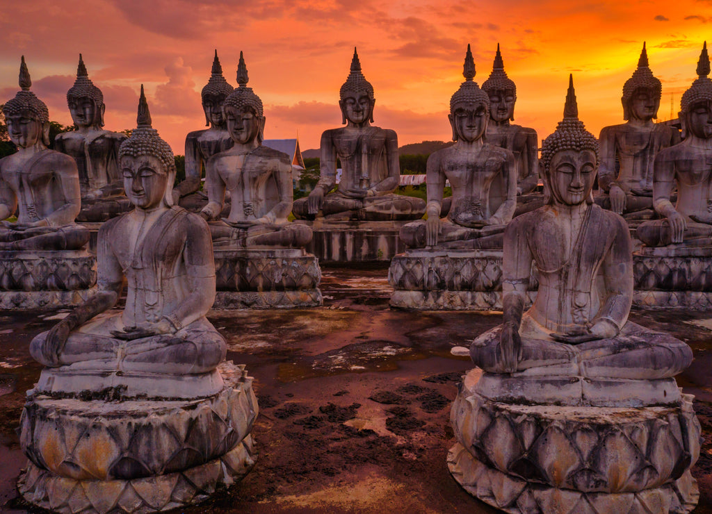 Many Statue buddha image at sunset in southen of Thailand