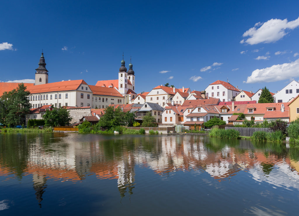 UNESCO protected Czech city Telc city scape on the castle with water reflection