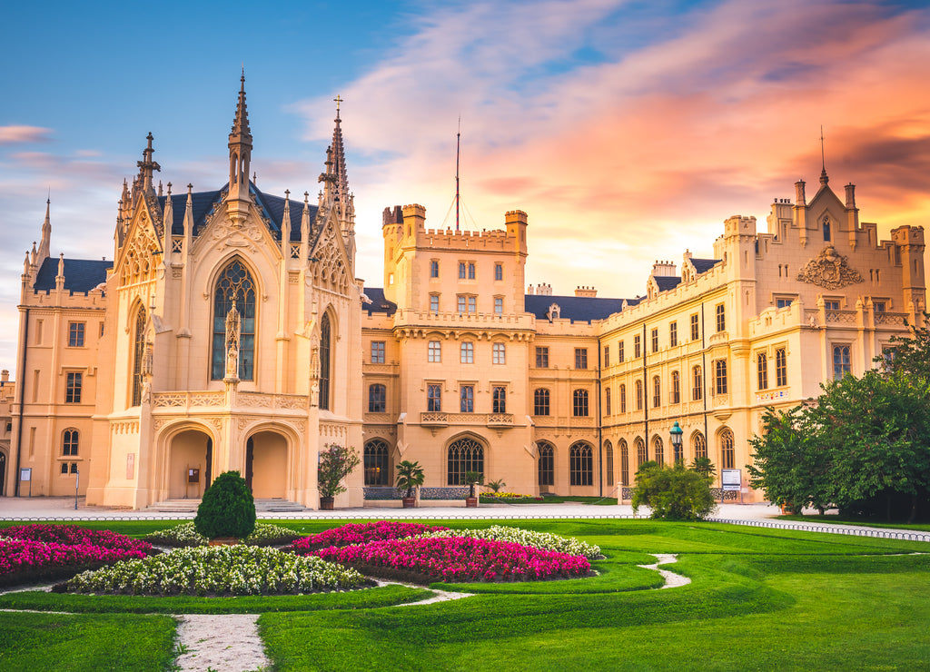 Lednice Chateau with beautiful gardens and parks on sunny summer day. Lednice-Valtice Landscape, South Moravian region. UNESCO World Heritage Site
