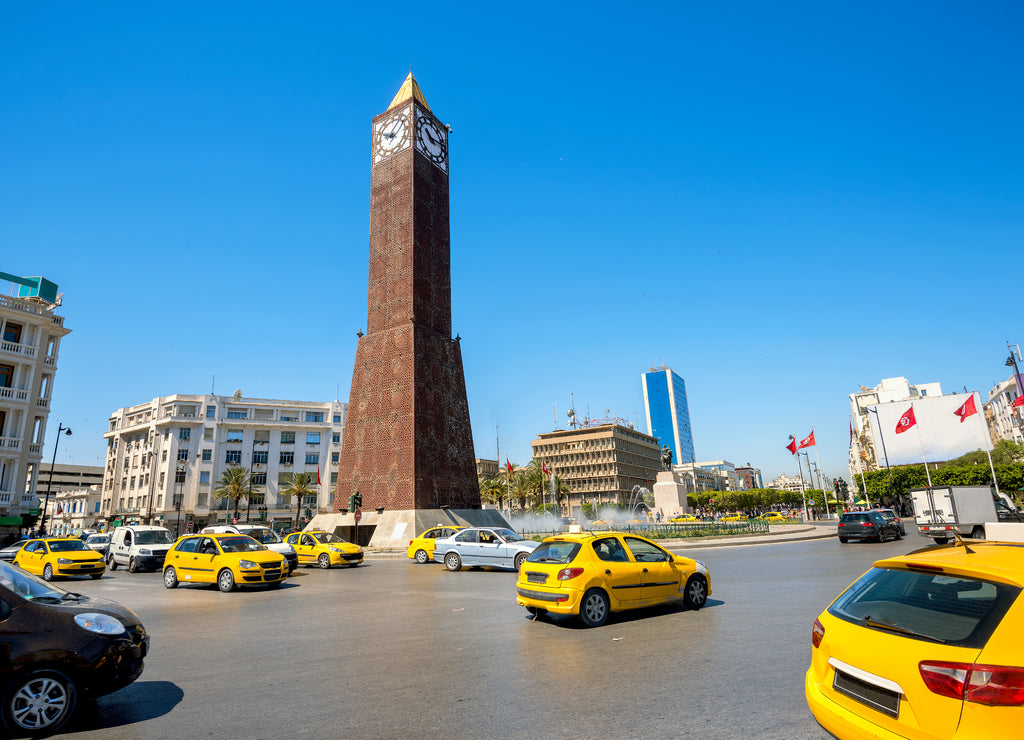 Cityscape with clock tower monument on central square in Tunis city. Tunisia, North Africa