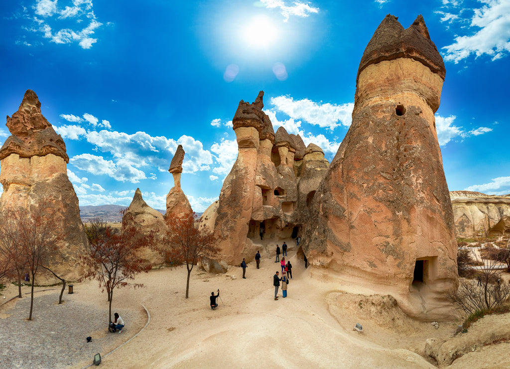 Picturesque landscape of shaped sandstone rocks. Famous Fairy Chimneys or Multihead stone mushrooms in Pasaba Valley near Goreme