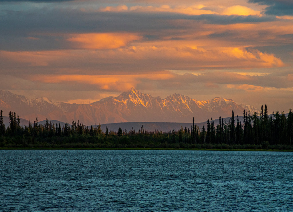 Midnight sun over lake in Alaska
