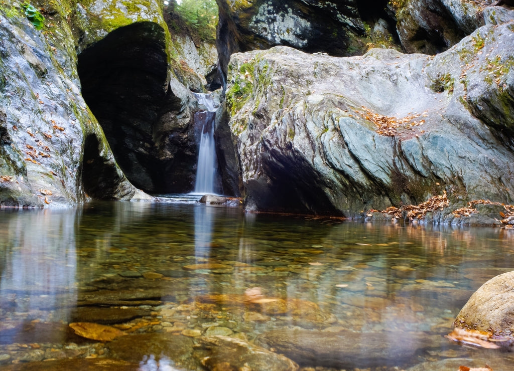 Scenic View Of Texas Waterfall And Lake Amidst Rocks
