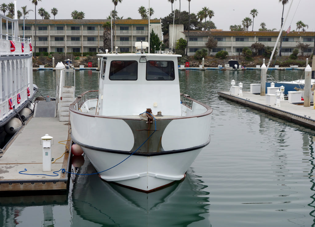 Recreational and fishing boats at the dock in Oxnard marina, Ventura county, Southern California Pacific coast