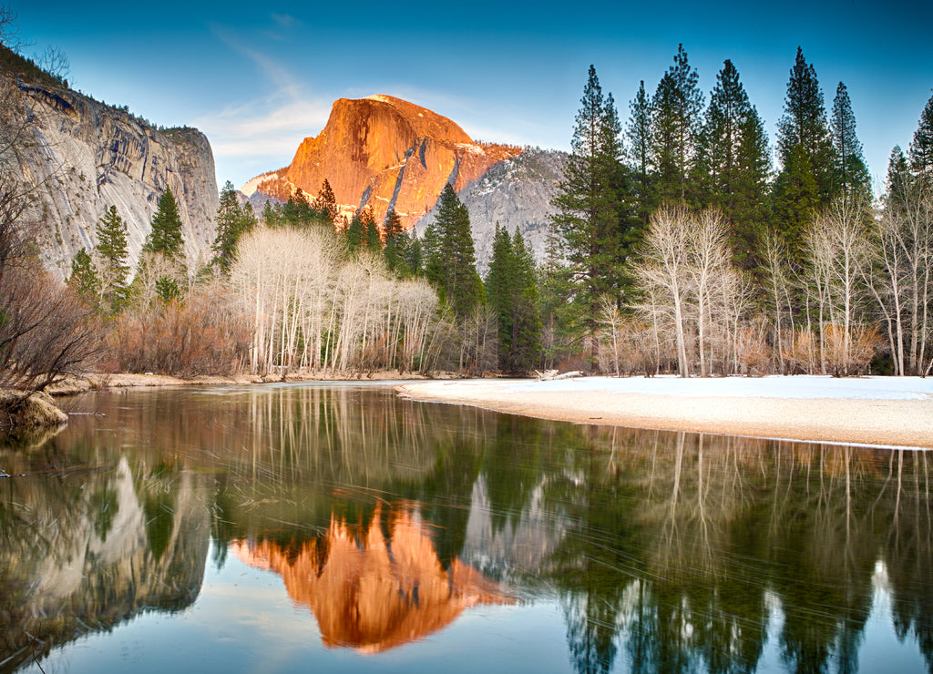 View of half dome reflected in the Merced river at Yosemite