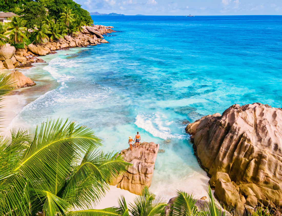 Noah Jigsaw Puzzle Anse Patates, La Digue Seychelles, a young couple of men and women on a tropical beach during a luxury vacation in Seychelles. Tropical beach Anse Patates, La Digue Seychelles 1000 pieces