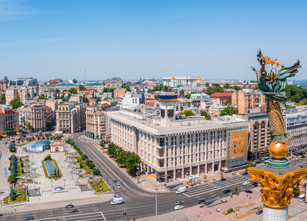 Aerial view of the Kyiv Ukraine above Maidan Nezalezhnosti Independence Monument. Golden beautiful Ukrainian woman statue in the middle of the city