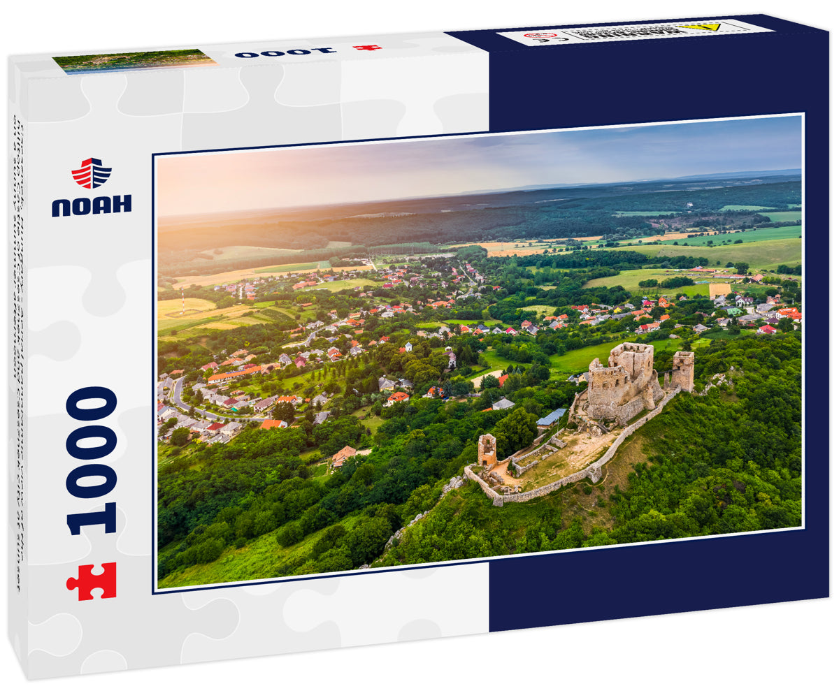 Csesznek, Hungary - Aerial panoramic view of the hilltop Castle of Csesznek and Csesznek city at sunset on a sunny summer afternoon