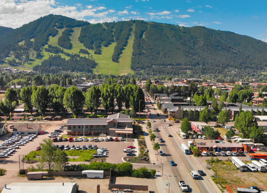 Panoramic aerial view of Jackson Hole homes and beautiful mountains on a summer morning, Wyoming