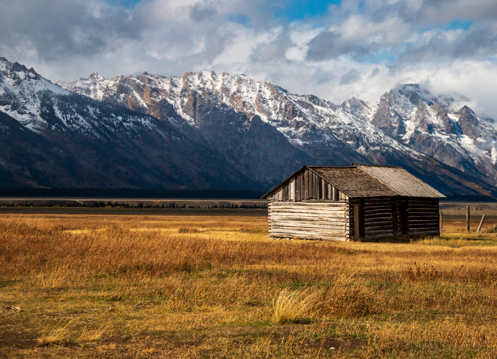 historic Moulton barns n Mormons' Row against the dramatic Teton mountain range in Wyoming
