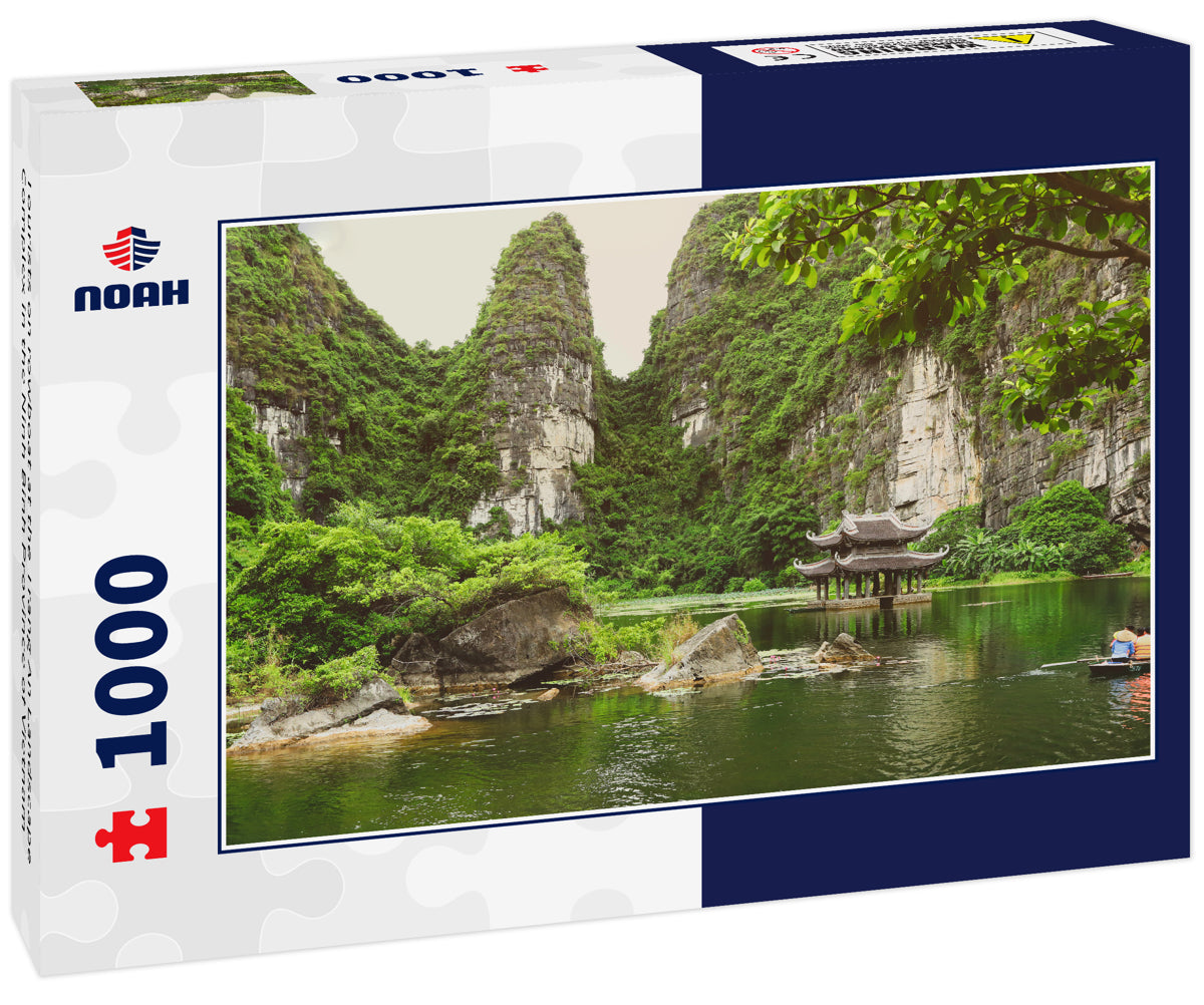 Tourists on rowboat at the Trang An Landscape Complex in the Ninh Binh Province of Vietnam