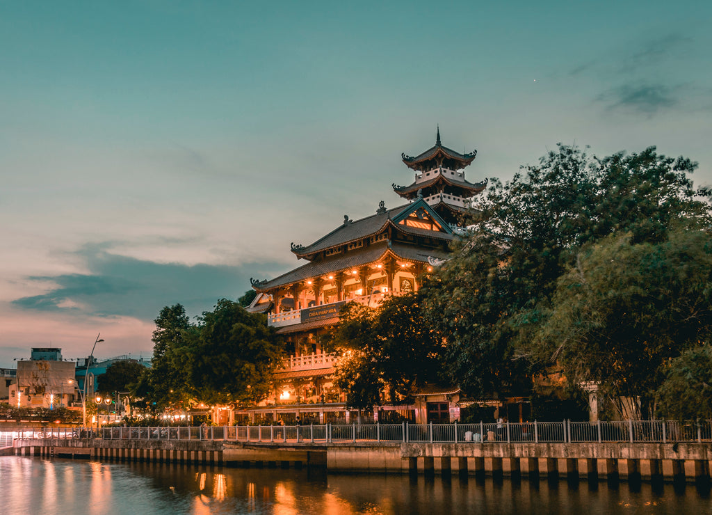 Night scene of Phap Hoa pagoda along Nhieu Loc canal (Saigon river) at night in Ho Chi Minh City, Vietnam