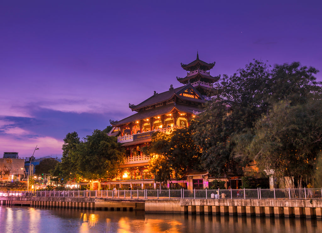 Night scene of Phap Hoa pagoda along Nhieu Loc canal (Saigon river) at night in Ho Chi Minh City, Vietnam