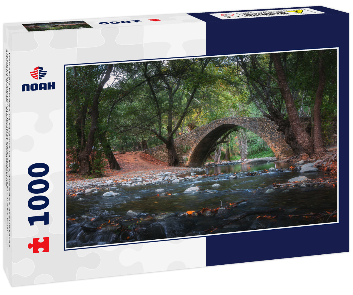 Venetian bridge in Cyprus in the Troodos mountains. Beautiful autumn landscape with river, trees and ancient bridge. Medieval architecture