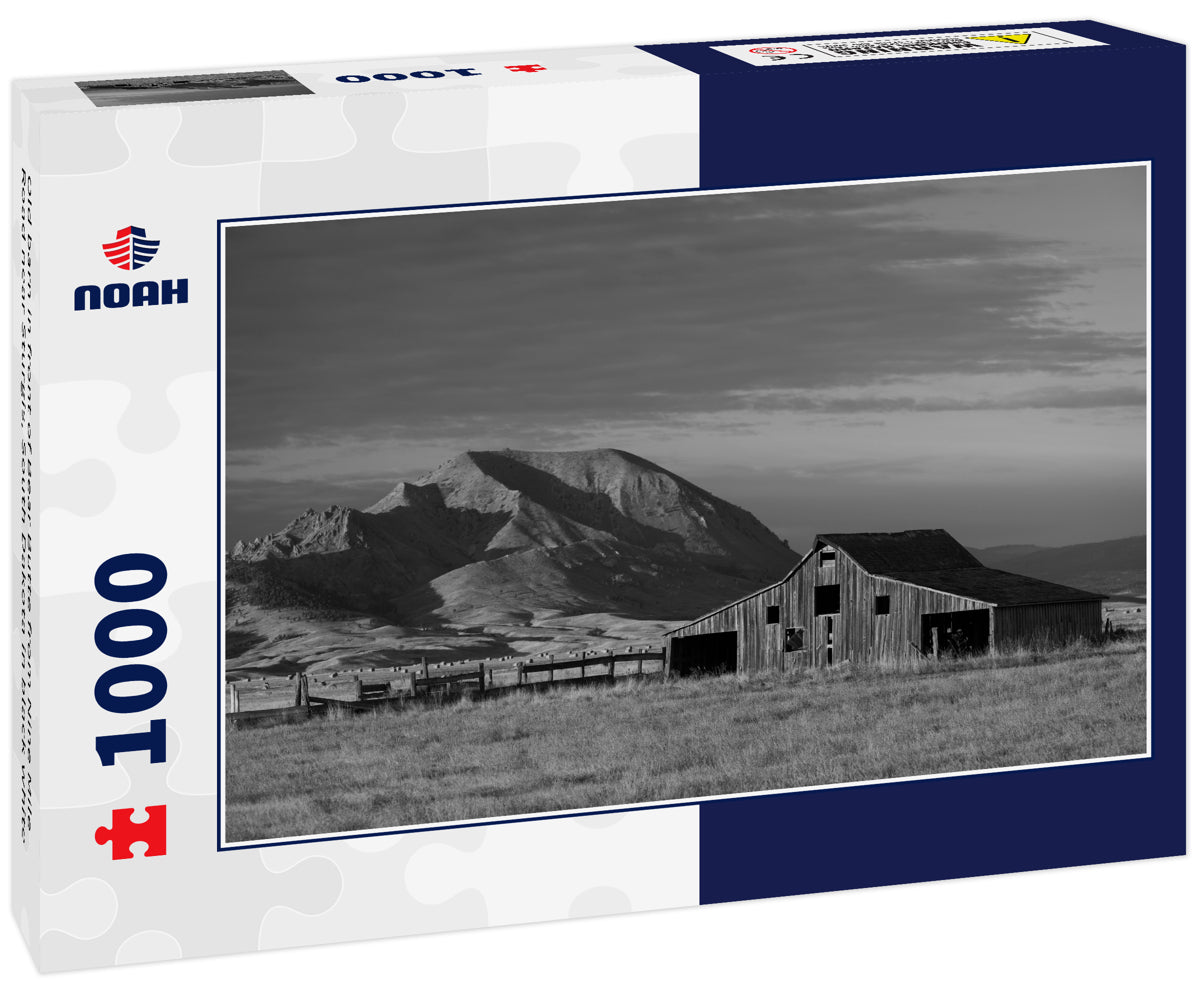 Old barn in front of Bear Butte from Nine Mile Road near Sturgis, South Dakota in black white