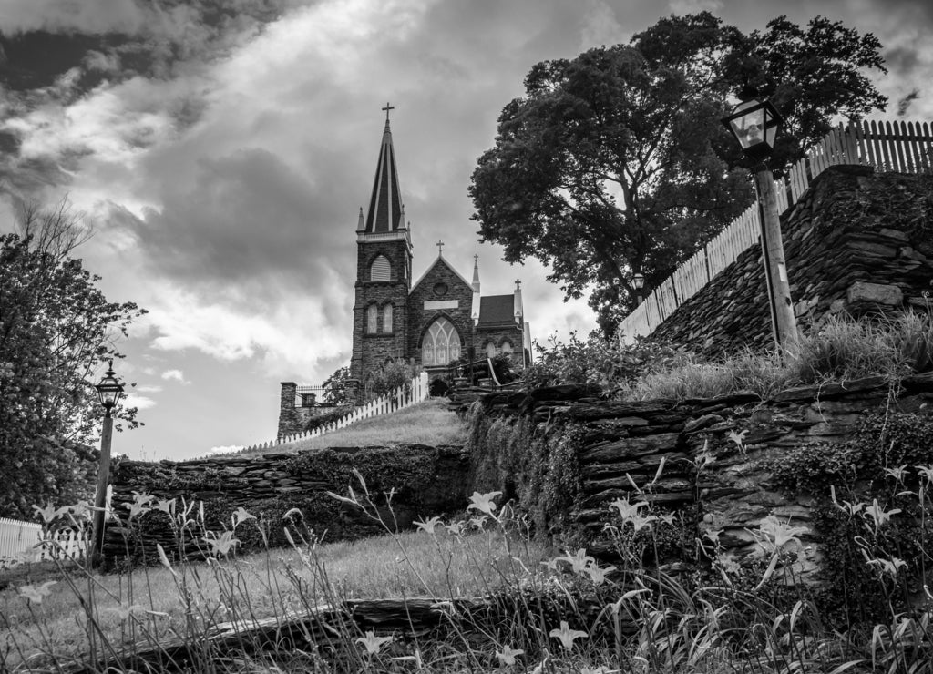 Orange lillies and St. Peters Roman Catholic Church, in Harpers, West Virginia in black white