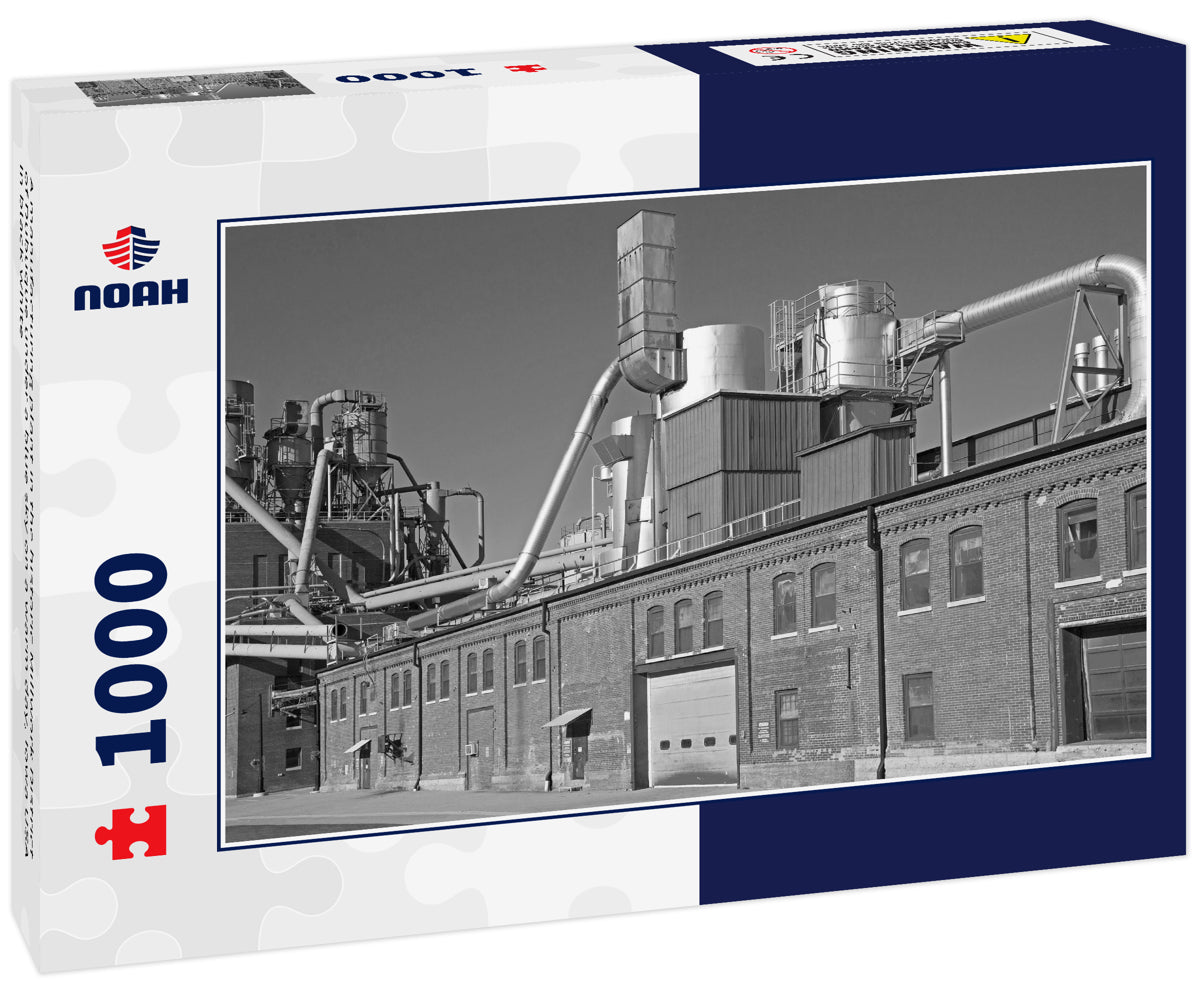A manufacturing plant in the historic Millwork District of Dubuque under a blue sky on a warm day, Iowa USA in black white