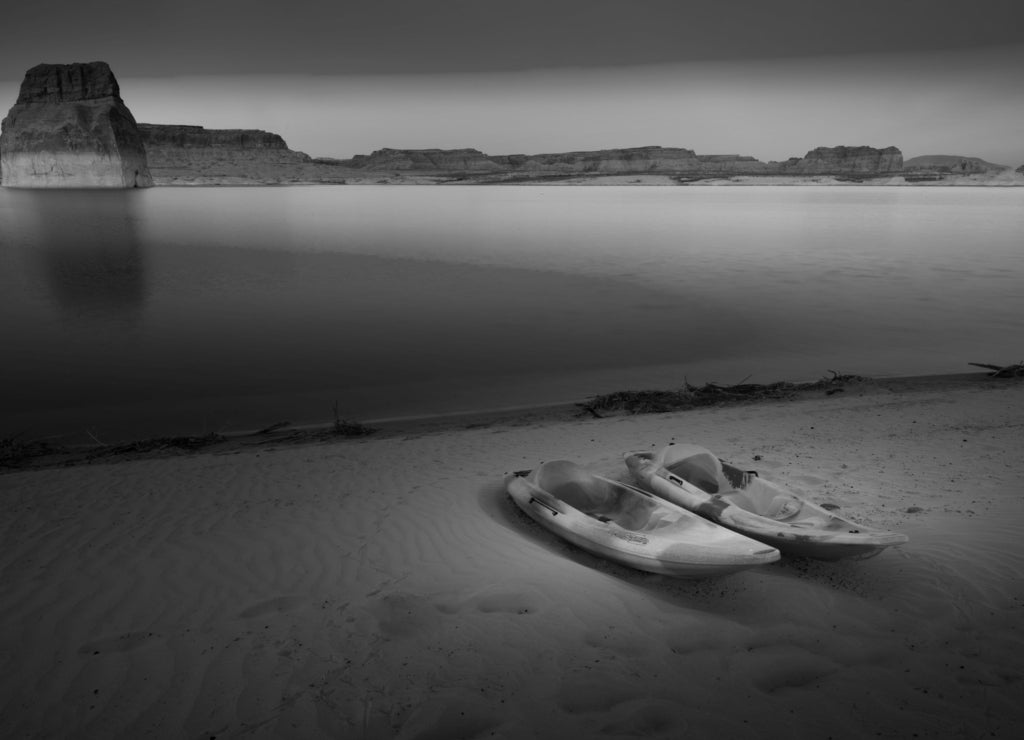 Kayaking Lake Powell Lone Rock at Sunset Utah USA in black white