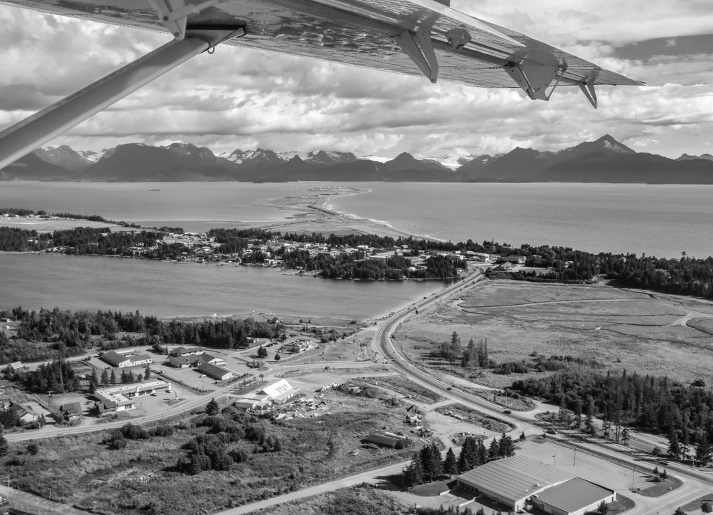 Aerial view from an airplane of Homer Spit and Kachemak Bay, Kenai Peninsula, Alaska in black white