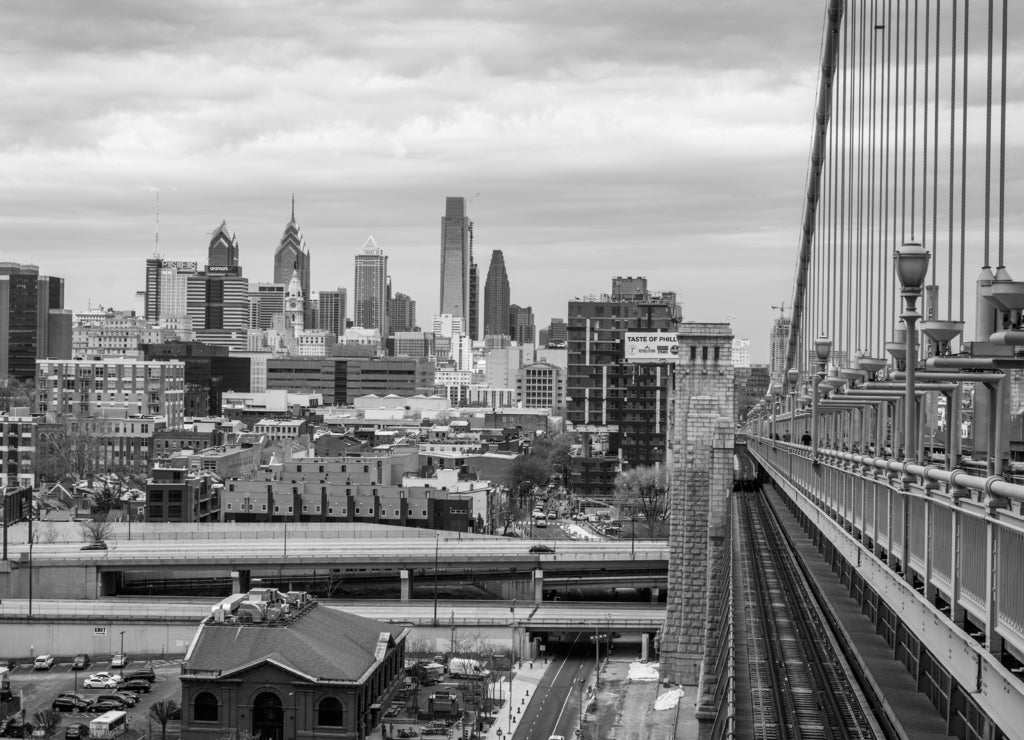 Skyline of downtown philadelphia, pennsylvania from Benjamin Franklin bridge in spring in black white