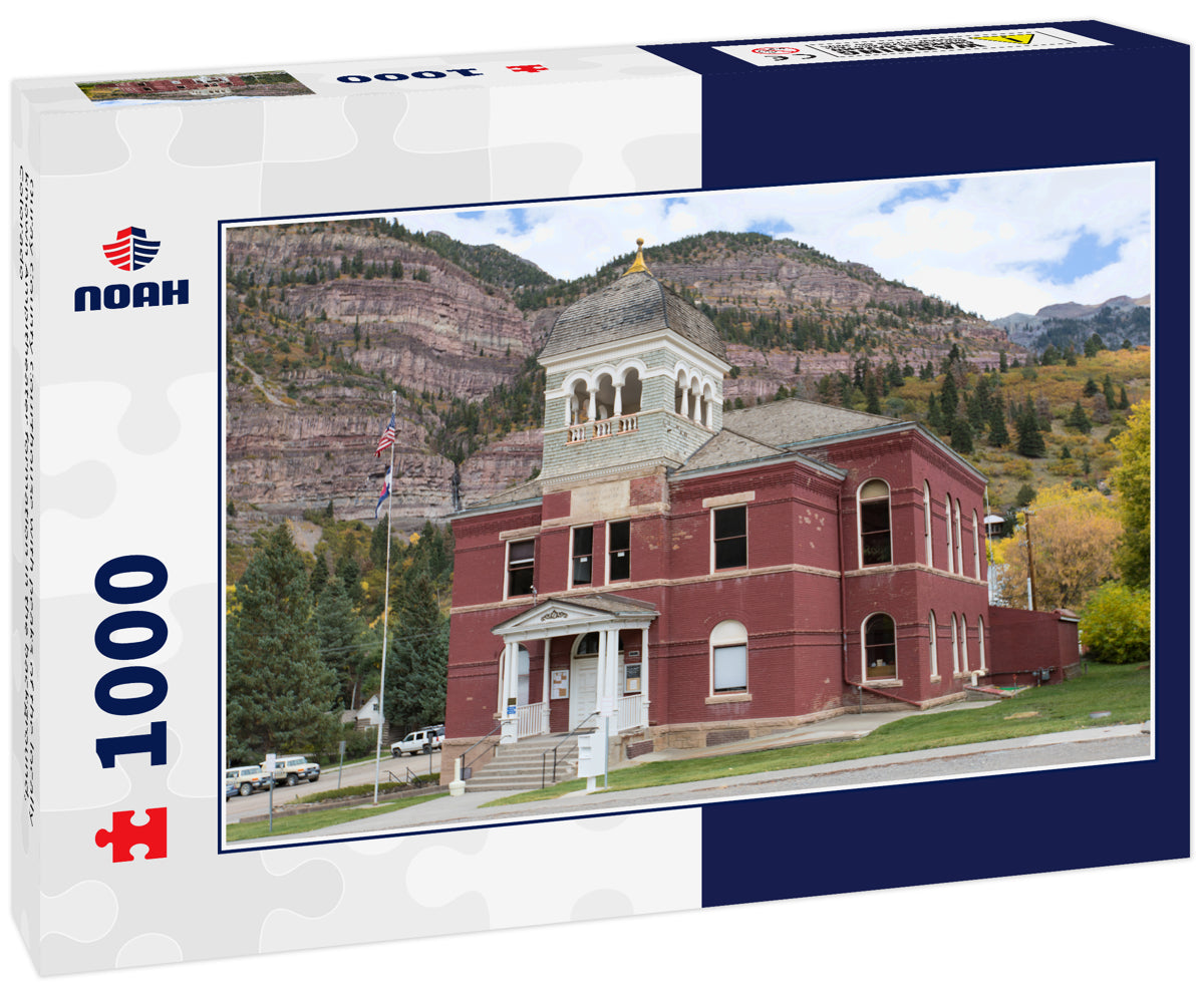 Ouray County Courthouse with peaks of the locally known Ampitheater formation in the background, Colorado