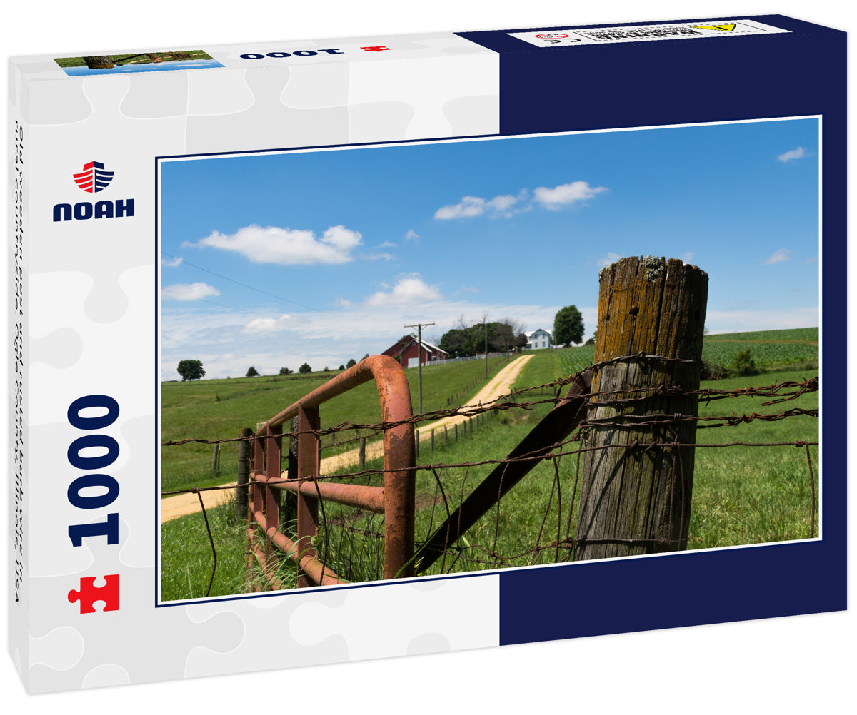 Old wooden post and rusted barb wire in rural countryside. Ogle County, Illinois, USA