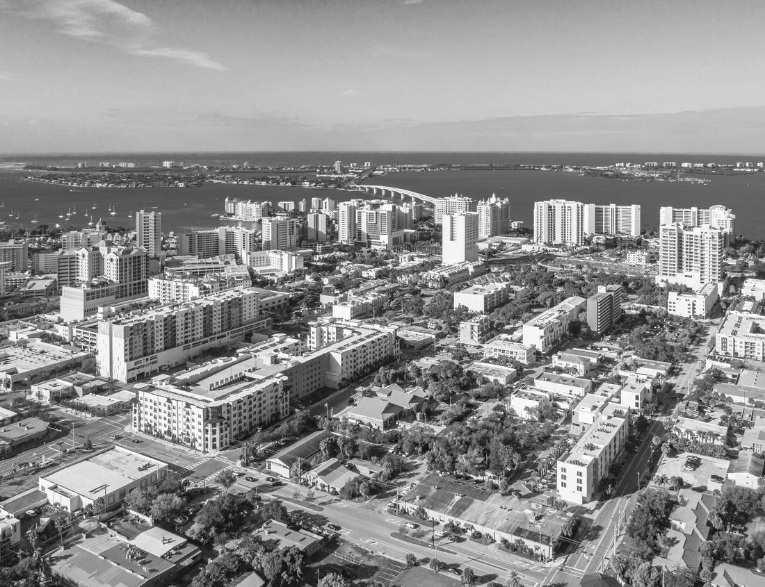 Noah Jigsaw Puzzle Jacksonville City Downtown Skyline and buildings with dramatic winter storm clouds over John T. Alsop Jr. Bridge, the landmark lift bridge on Main Street over the St. Johns River in North Florida in black white 1000 pieces
