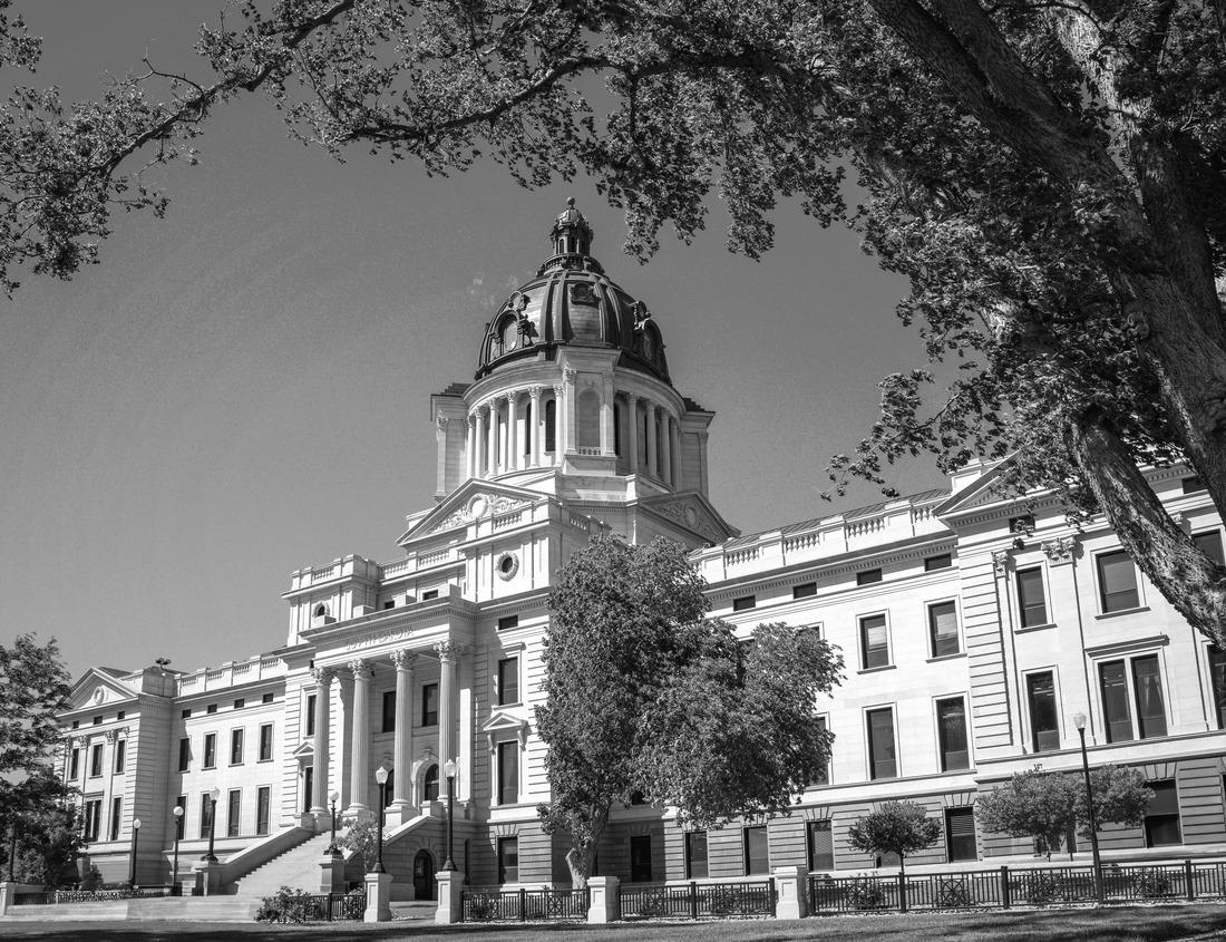 Noah Jigsaw Puzzle Yellow electric tram on a street with colorful houses and flowers on the balconies - Bica Elevator going down the hill of Chiado in Lisbon, Portugal in black white 1000 pieces