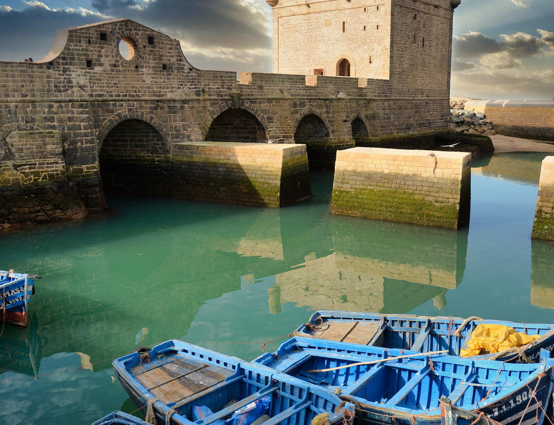 The blue fishing boats and in the background the tower of the Sqala, Essaouira, Morocco 1000pc Puzzle