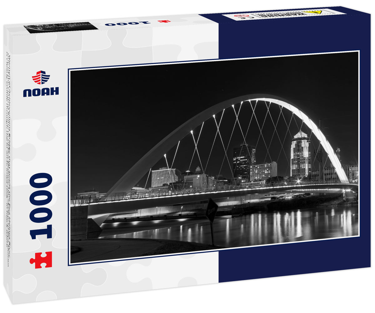 Women of Achievement Bridge that spans the Des Moines River - one of the central features of Des Moines, the skyline of Des Moines is clearly visible through the lit arch, Iowa USA in black white