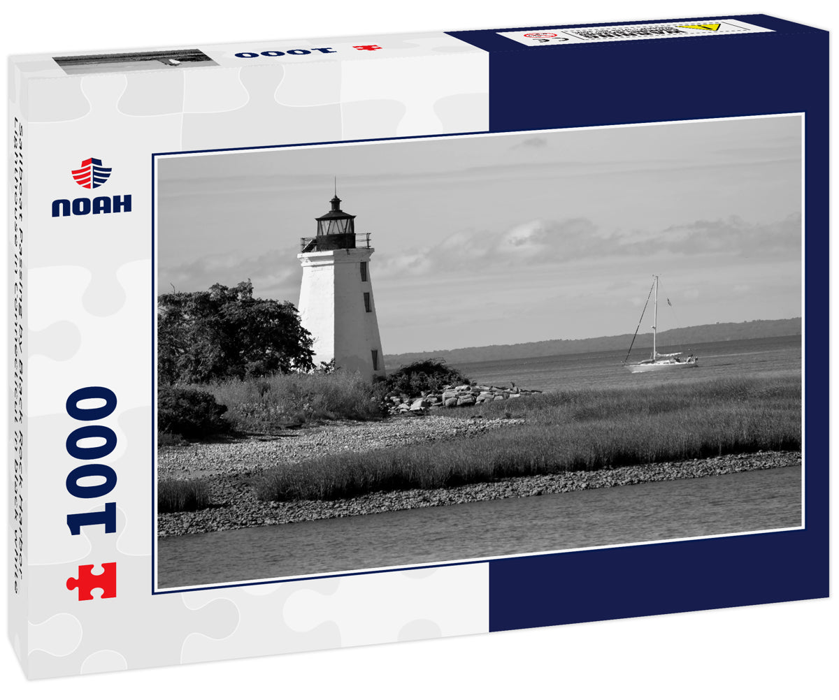 Sailboat Passing by Black Rock Harbor Lighthouse in Connecticut in black white