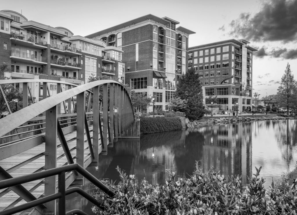 Greenville, South Carolina, USA downtown cityscape on the Reedy River at dusk in black white