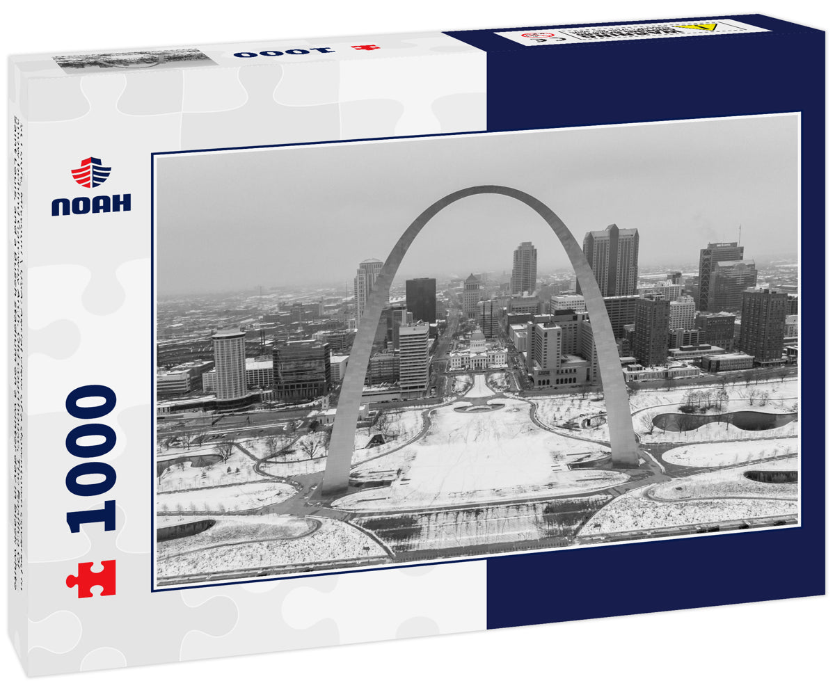 St Louis, Missouri \ USA: Aerial view of a downtown covered in snow behind Gateway Arch. Old courthouse, The Basilica Of Saint Louis, and a Busch stadium on a winter day in black white