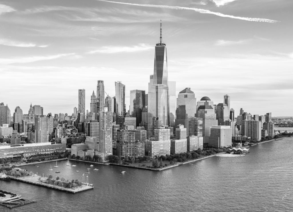 Aerial view with Lower Manhattan skyline at sunset viewed from above Hudson River in black white