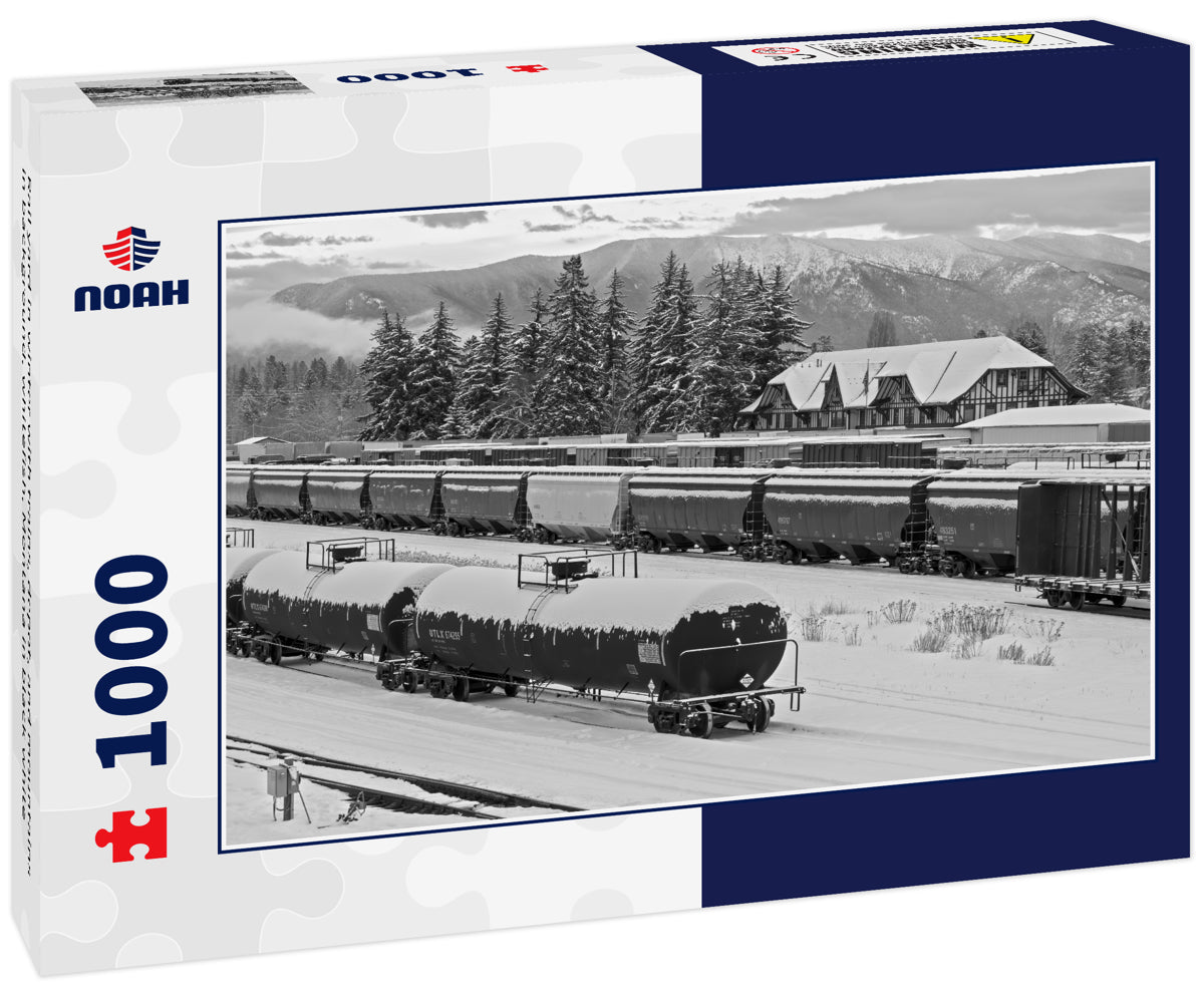 Rail yard in winter with trains, depot, and mountains in background, whitefish, Montana in black white