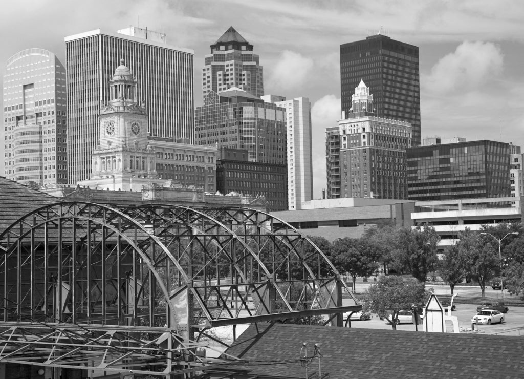 Old Railroad Station framing view of Des Moines skyline, capital of Iowa in black white