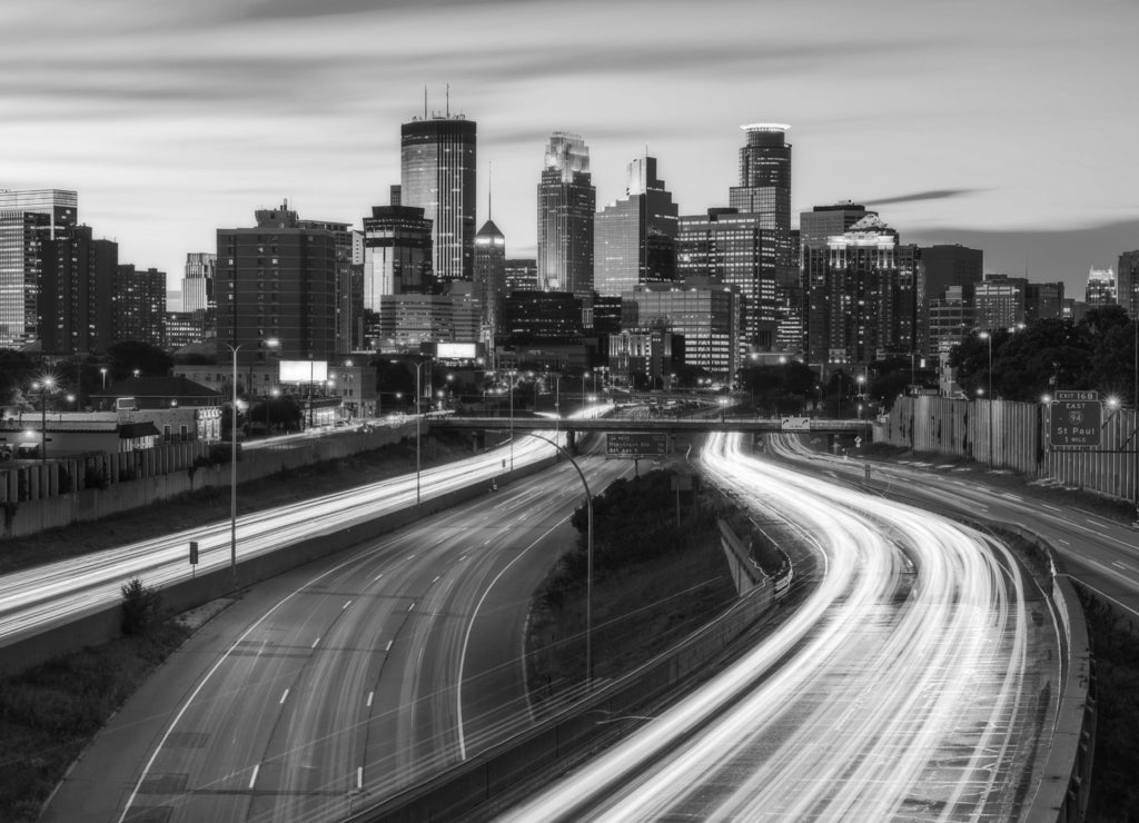 Minneapolis skyline with traffic light at night in black white