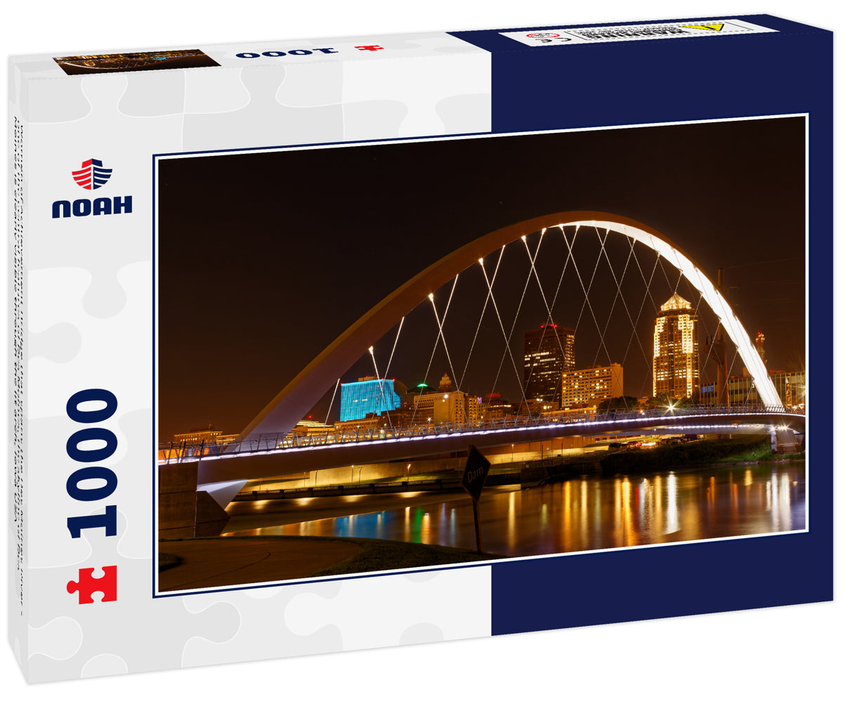 Women of Achievement Bridge that spans the Des Moines River - one of the central features of Des Moines, the skyline of Des Moines is clearly visible through the lit arch, Iowa USA