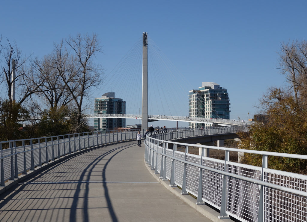 The Bob Kerrey Pedestrian Bridge crosses over the river, connecting Omaha, Nebraska with Council Bluffs, Iowa