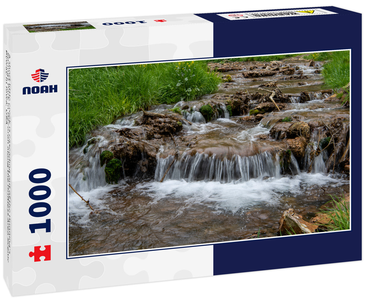 A short little creek is cascading out of the Dunning's Springs Park in Decorah along the Driftless Area Scenic Byway in Iowa, USA