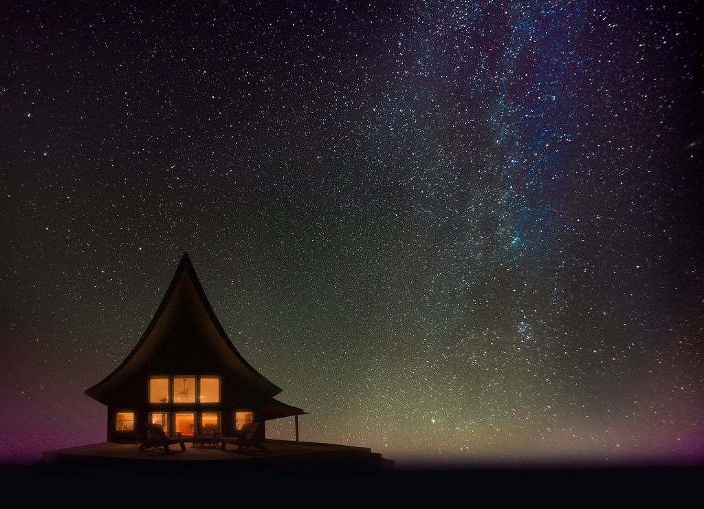 Silhouette of a cozy cabin at night overseeing Lake Superior, Upper Peninsula, Michigan
