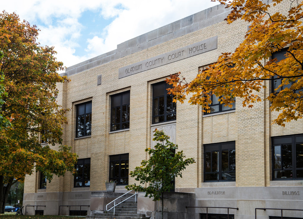 The state courthouse for Gladwin County located in Gladwin, Michigan with fall leaves