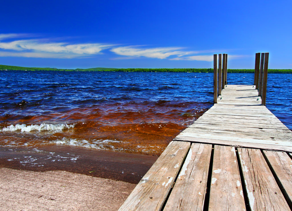 Wooden dock and choppy waters of Lake Gogebic at Ontonagon County Park Michigan