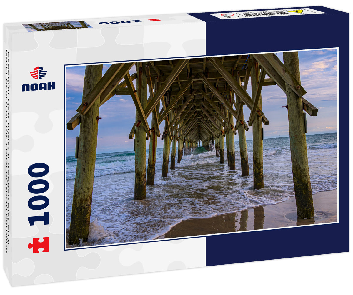 Beautiful view under a wooden pier on a water beach on the coast of North Carolina