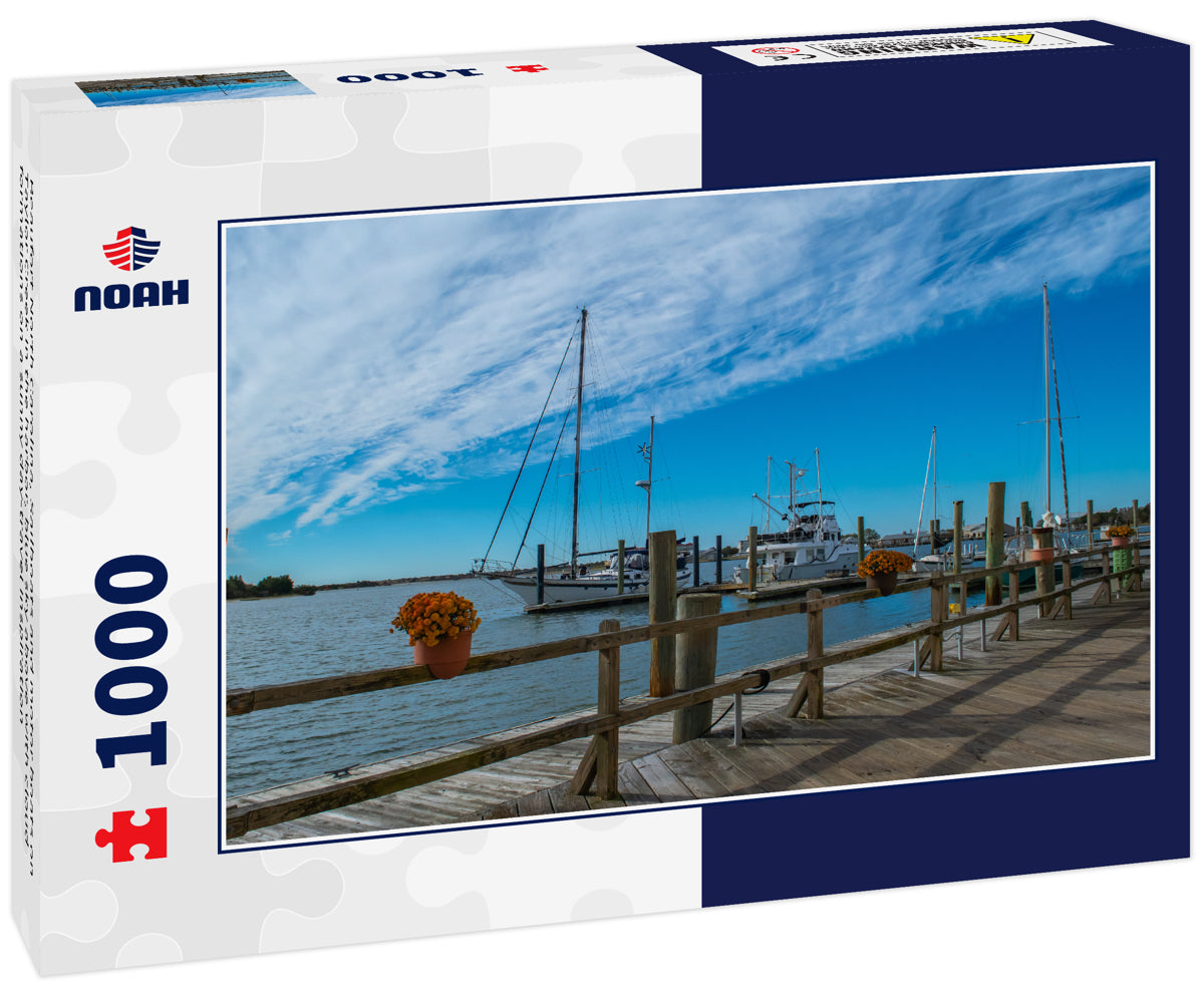 Beaufort North Carolina, Sailboats and motor boats on Taylor Creek in the harbor, blue sky above with cloud formations on a sunny day-travel inspiration